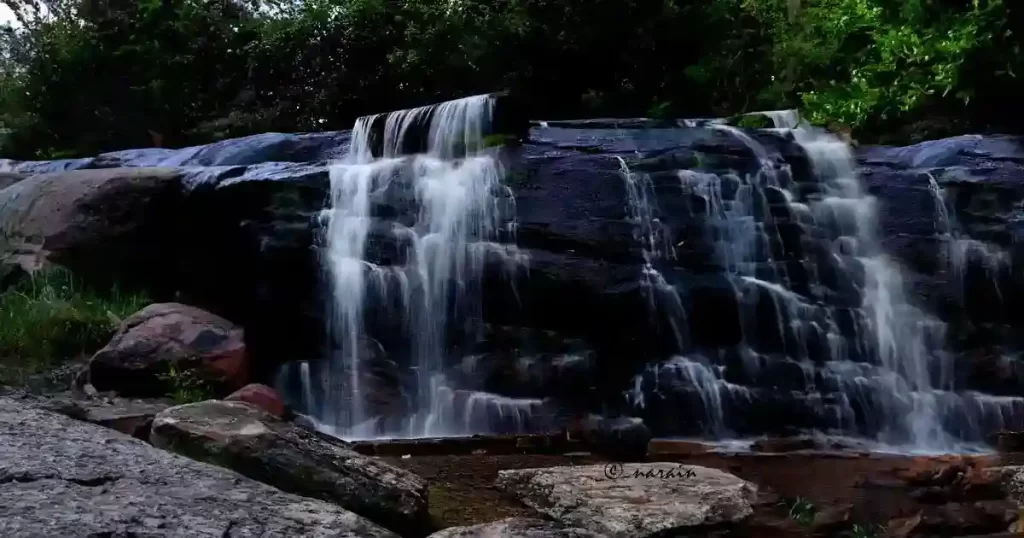 An image of  Karimutti Waterfall, included in the blog, for informational purposes. 